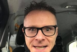 Image of Richard taken at the wheel of his cab looking angry with his ADHD